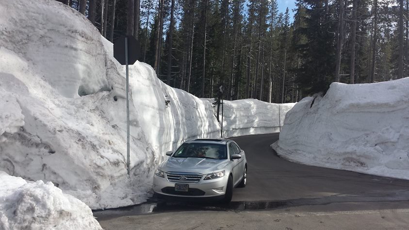 now piled up 12 feet on the sides of the road.
