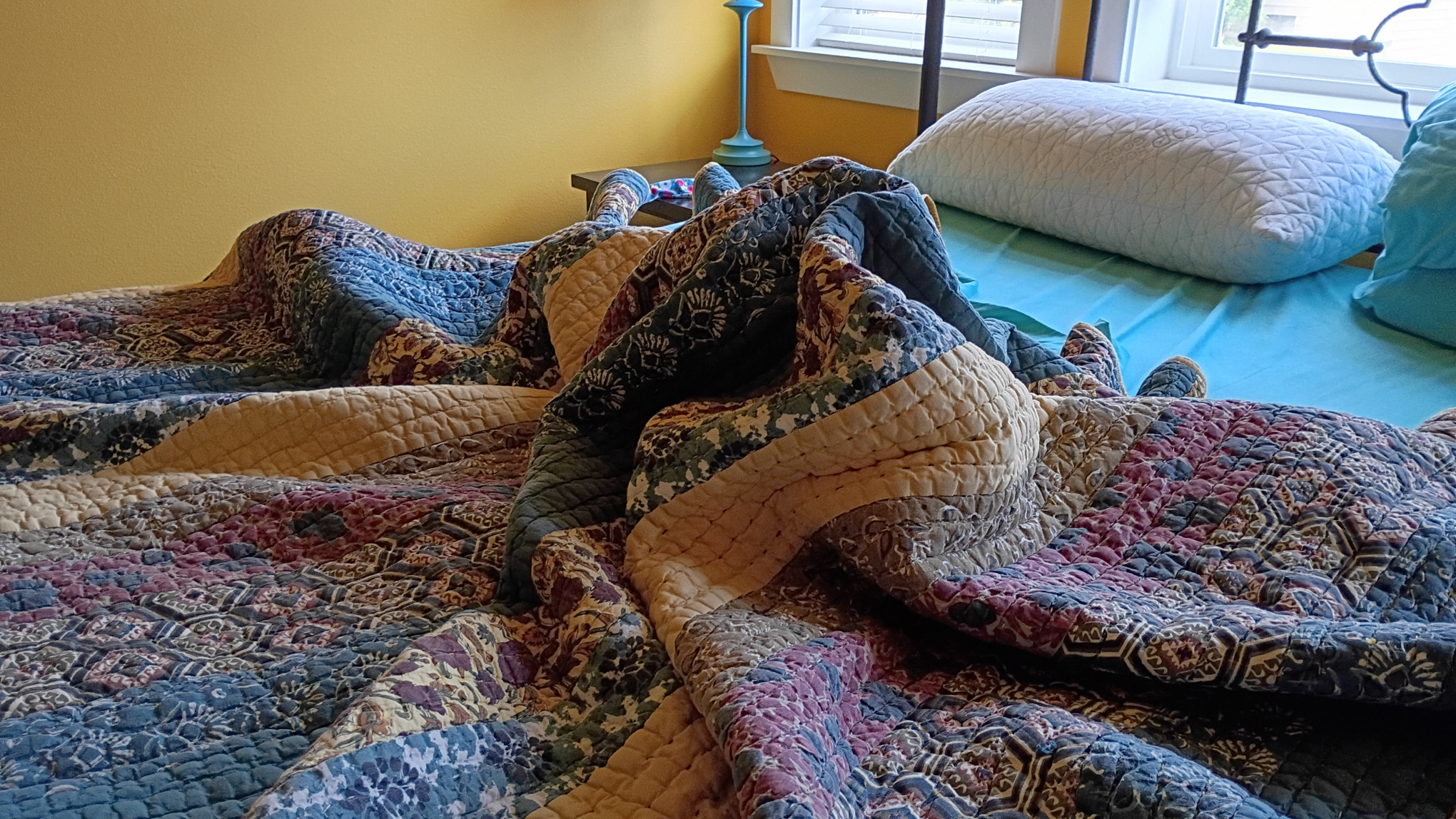 Bed cover and sheets formed into Mt. St. Helens.