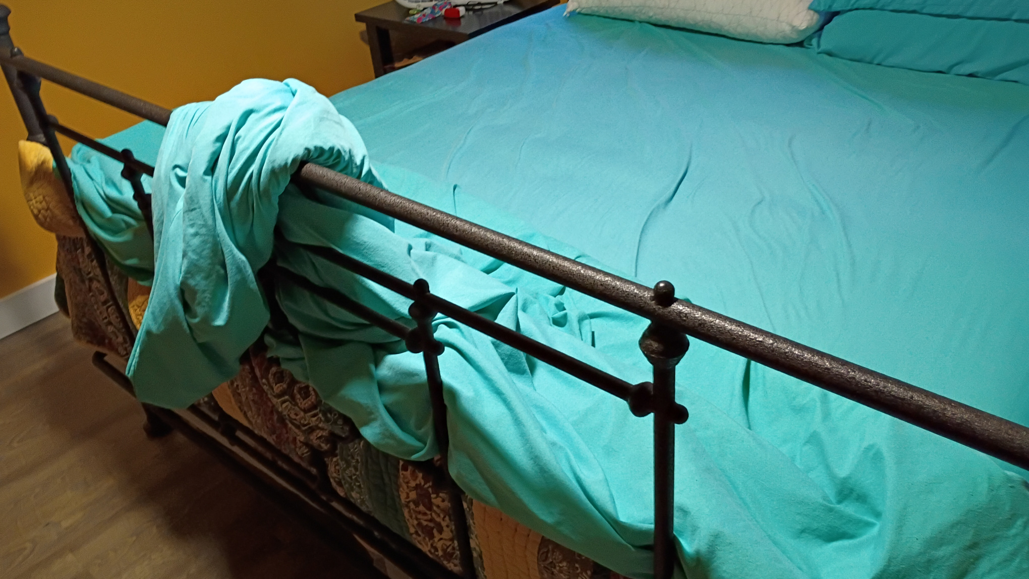 Bed cover and sheets formed into a waterfall.