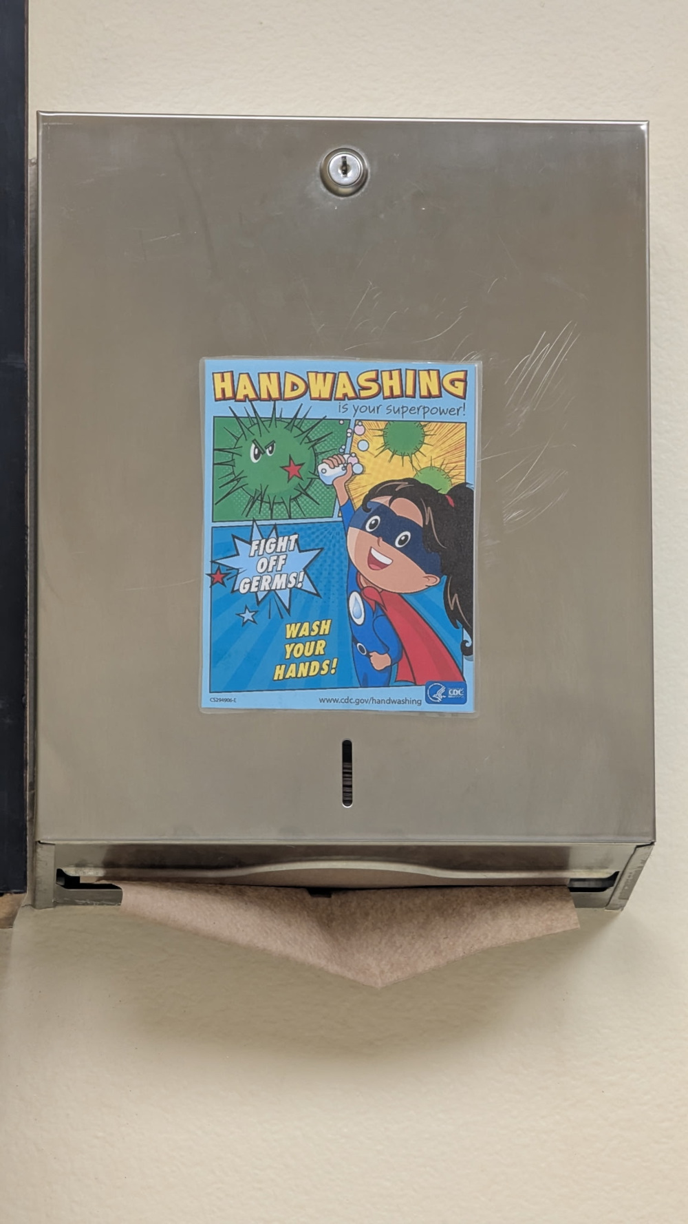 Cartoon depicting a superhero telling people to wash their hands to fight infection.