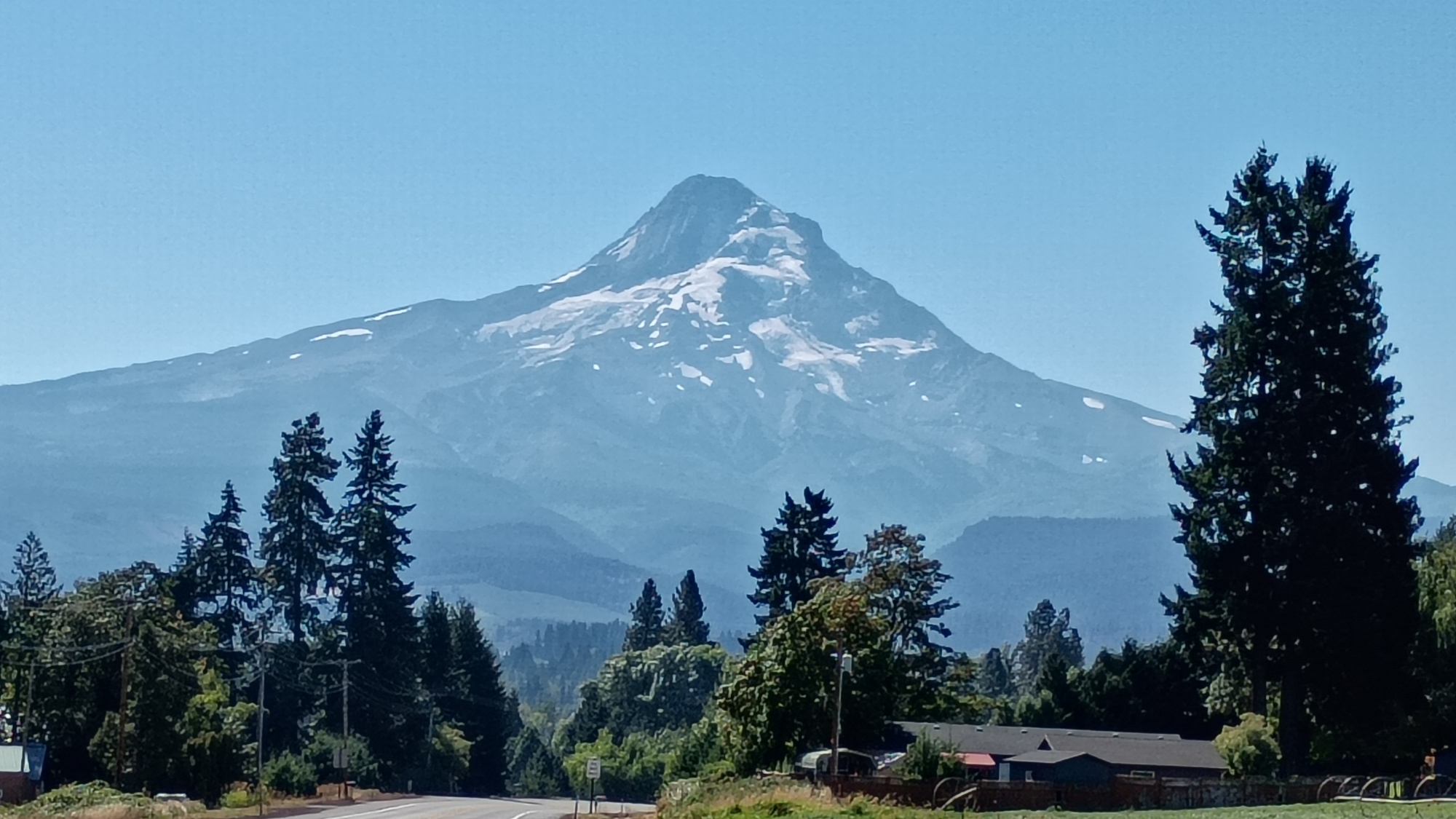 Mt. Hood from right around Parkdale, Oregon. Hazy sky meets giant volcano on a sunny day.