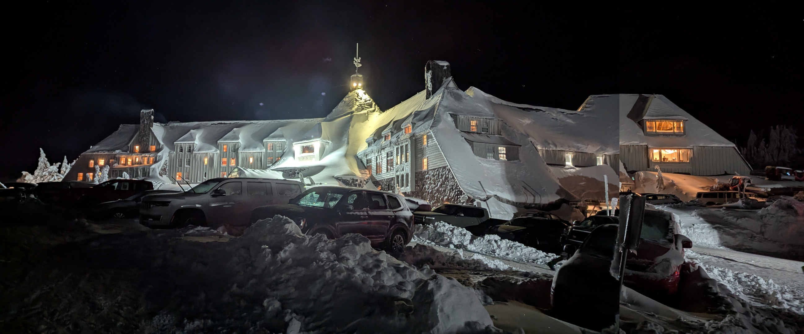 Nighttime. Feet of snow piled and drifted everywhere. The entirety of the southwest facade of Timberline Lodge.