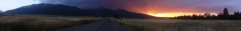 Sun just fell behind the Wallowas. Golden wheat in the foreground.
