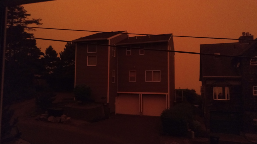 Looks like Mars. The house across the street steeped in wildfire smoke tinted reddish orange.