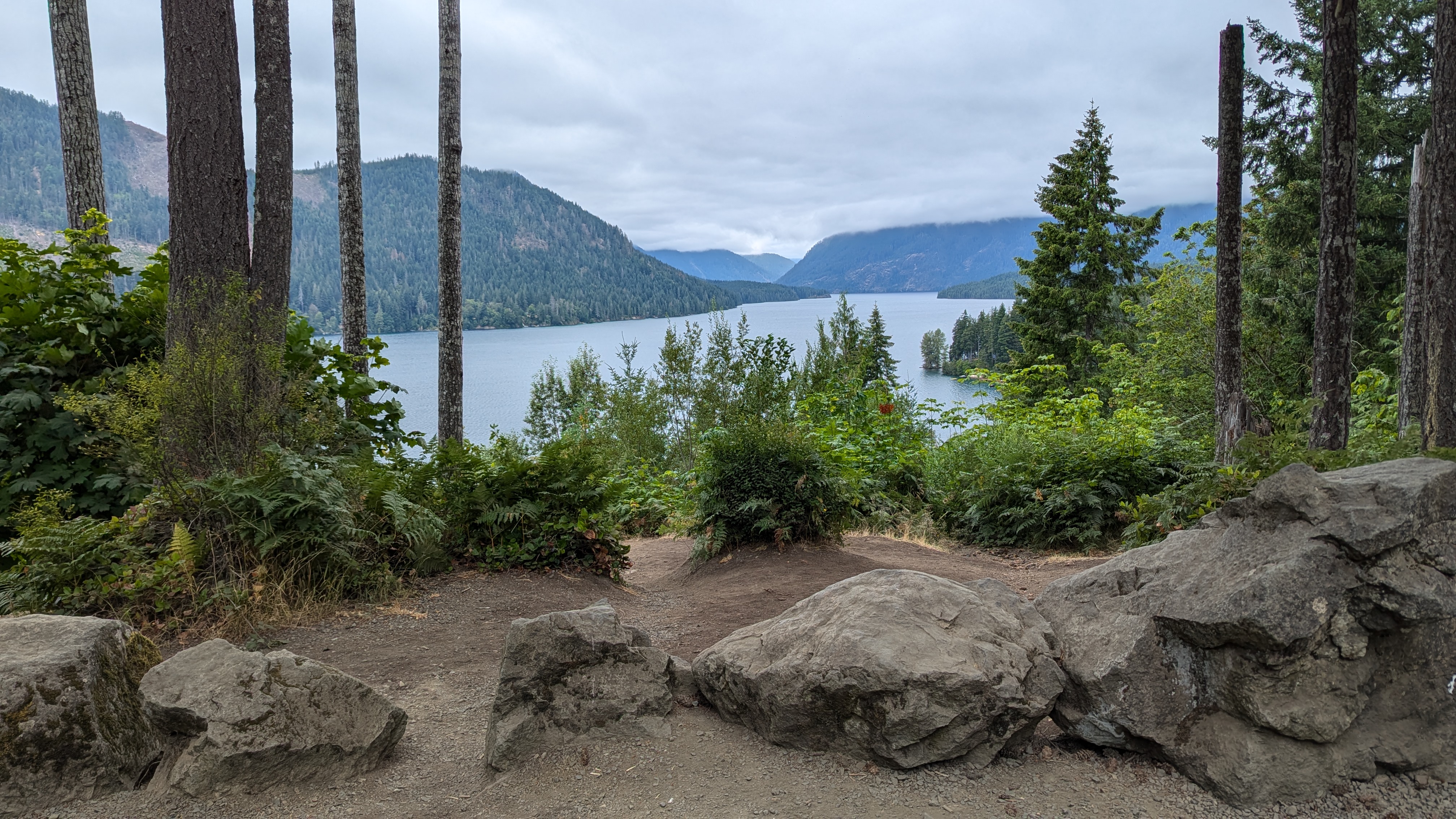 Lake Cushman surrounded by conifer mountains as seen from a picnic area.